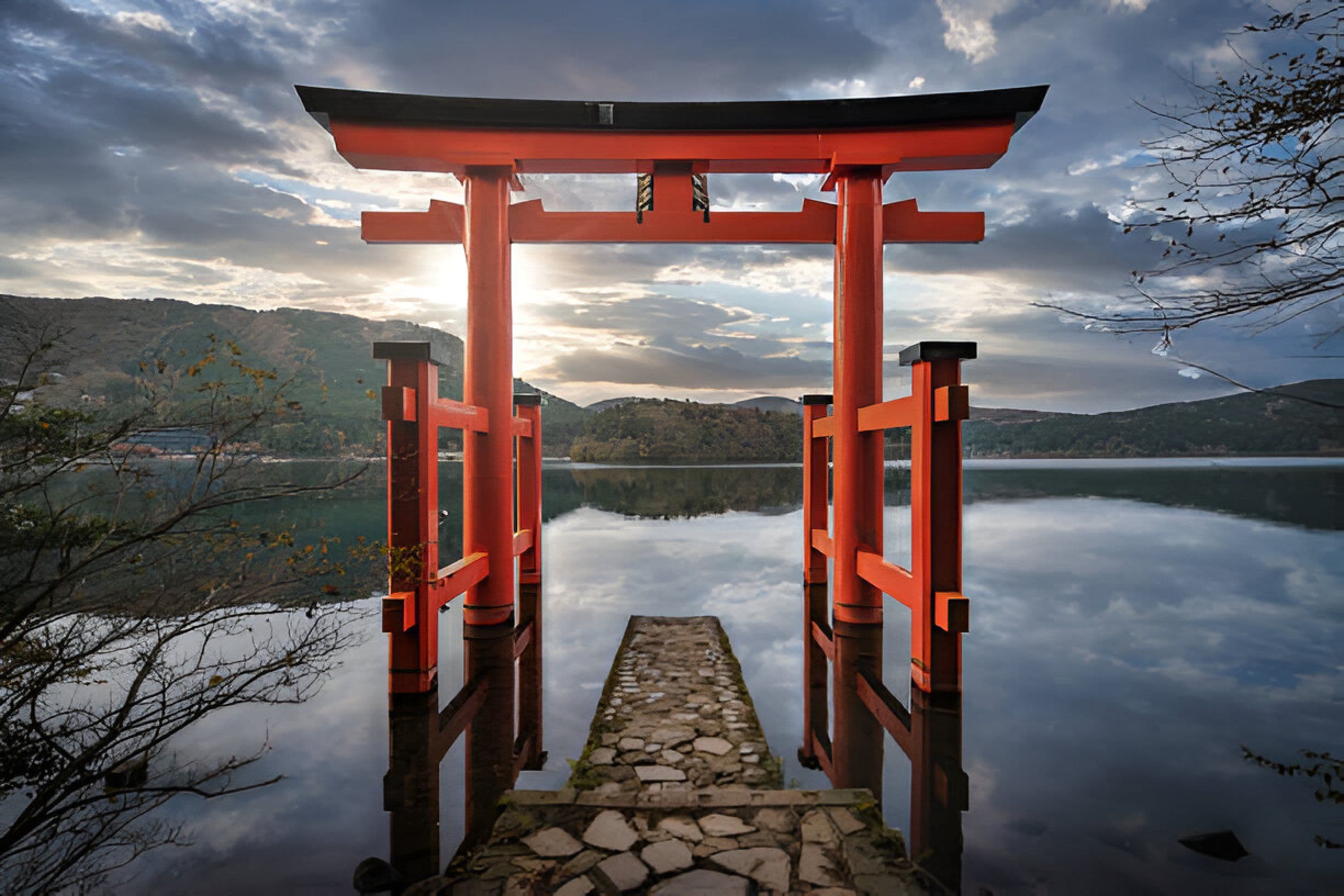Red torii gate reflected in Lake Ashi during Hakone day tour Japan
