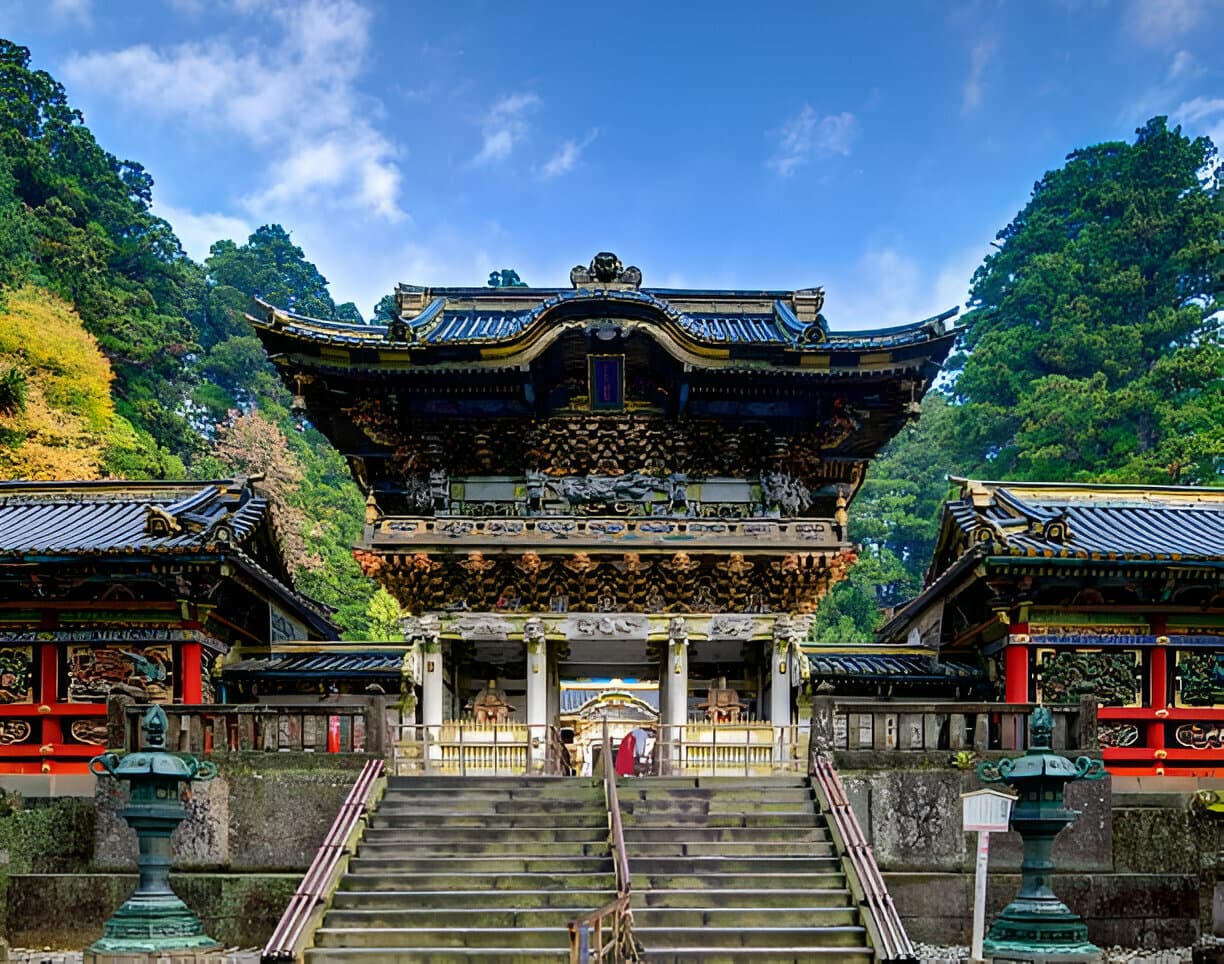 Yomeimon Gate at Toshogu Shrine surrounded by trees in Nikko Japan